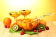 punch in bowl and glasses with fruits,