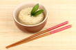 asian noodles in bowl on bamboo mat