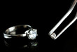 Shining crystal (diamond) in the tweezers and ring,