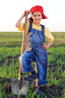 Smiling girl with shovel