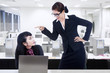 Businesswoman yelling at employee