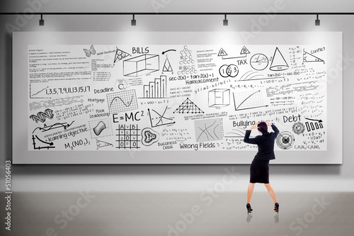 Photo: Businesswoman thinking in front of billboard Businesswoman thinking in front of billboard