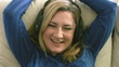Woman listening to music with headphones