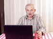 Photo: Old man using technology Old man using technology