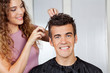 Client Getting Haircut From Hairdresser