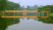 yellow bridge with reflections on  lake