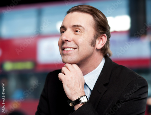 Photo: Business professional looking at something Business professional looking at something