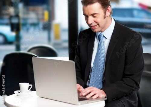 Photo: Work on the move. Businessman working Work on the move. Businessman working