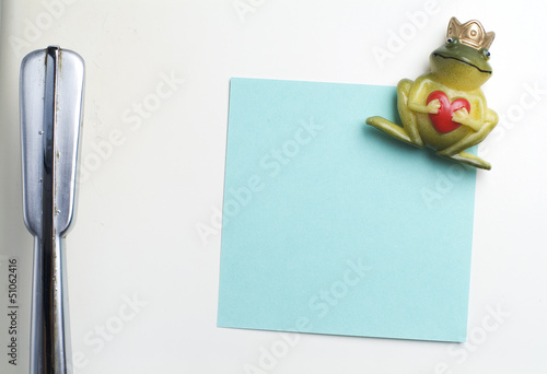 Photo: Blank note on fifties fridge-door, close-up of frog with crown h Blank note on fifties fridge-door, close-up of frog with crown h