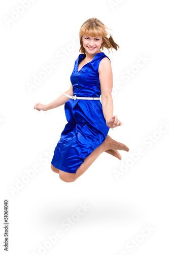 Photo: Cute elegant woman in blue dress jumping Cute elegant woman in blue dress jumping