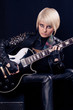 Beautiful blonde with electric guitar