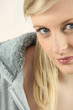 Photo: Closeup of a pretty blonde in a grey hoody Closeup of a pretty blonde in a grey hoody