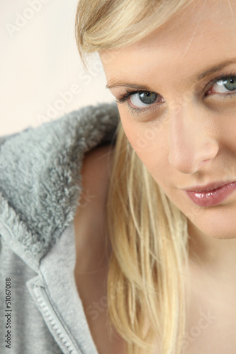 Photo: Closeup of a pretty blonde in a grey hoody Closeup of a pretty blonde in a grey hoody