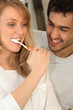 Couple brushing teeth