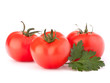 Three tomato vegetables and parsley leaves still life