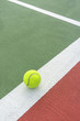 Tennis ball on the white line.