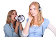 girl listening to music and friend shouting in loudspeaker