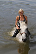 Photo: Girl swiming with her horse Girl swiming with her horse