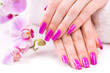 beautyful manicure with fragrant orchid and towel. Spa