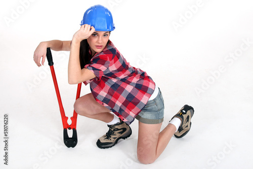 Photo: Female worker with pliers. Female worker with pliers.