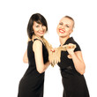 Photo: two pretty women smiling and standing together two pretty women smiling and standing together