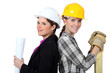 craftswoman and businesswoman standing back to back
