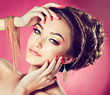 Model with Coral makeup and manicure