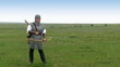 Medieval warrior - girl shoots a bow