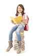 Schoolgirl sitting on the books