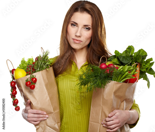 Photo: Young woman with a grocery shopping bag. Isolated on white backg Young woman with a grocery shopping bag. Isolated on white backg