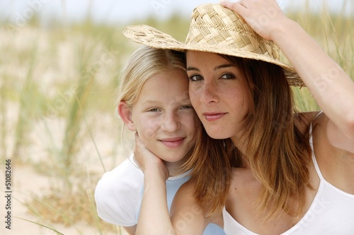Photo: Young girl with her mother Young girl with her mother