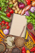 Foto: Fresh vegetables and blank recipe book Fresh vegetables and blank recipe book