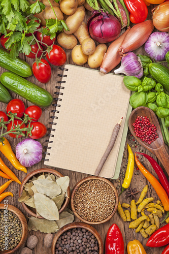Photo: Fresh vegetables and blank recipe book Fresh vegetables and blank recipe book