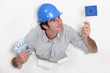 Man holding European flag and bank notes