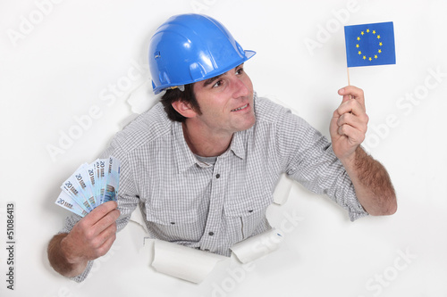 Photo: Man holding European flag and bank notes Man holding European flag and bank notes