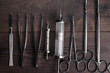 surgical armaments on wooden table