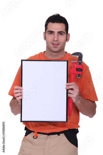 Photo: handyman showing a little white panel handyman showing a little white panel
