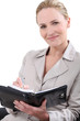 Woman writing in a personal organizer