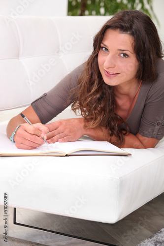 Photo: Holding a diary Holding a diary