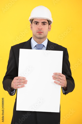 Photo: Architect holding advertising panel Architect holding advertising panel
