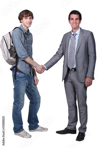 Photo: Student shaking teacher's hand Student shaking teacher's hand