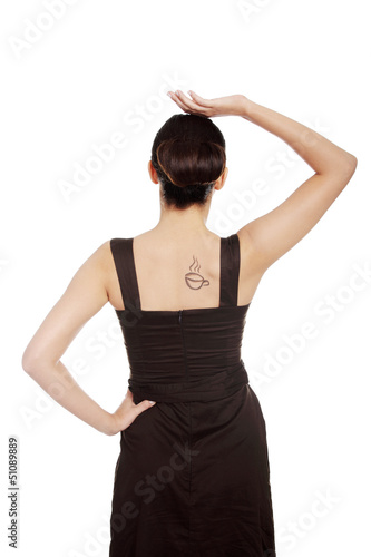 Photo: Woman in dress with coffee symbol on her back. Woman in dress with coffee symbol on her back.
