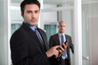 Serious businesswoman with a cellphone