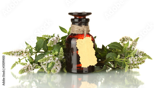 Photo: Essential oil and mint isolated on white Essential oil and mint isolated on white