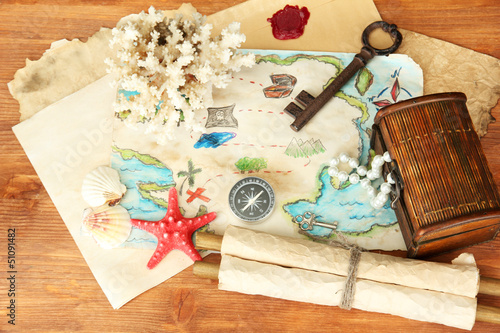 Photo: map of treasures on wooden background map of treasures on wooden background