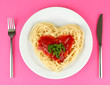 Photo: Cooked spaghetti carefully arranged in heart shape and topped Cooked spaghetti carefully arranged in heart shape and topped