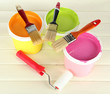 Set for painting: paint pots, brushes, paint-roller