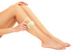 Foto: Beautiful woman doing depilation for her legs with waxing, Beautiful woman doing depilation for her legs with waxing,