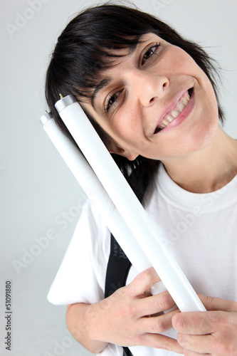 Photo: Woman holding tube bulb Woman holding tube bulb