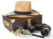 Black modern binoculars with suitcase and straw hat isolated